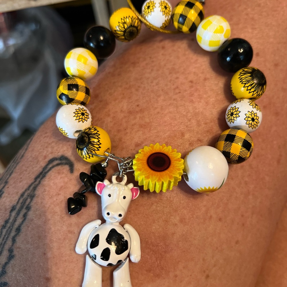 Hand Crafted Yellow and Black Jewelry Bracelet with Sunflower and Cow Charm